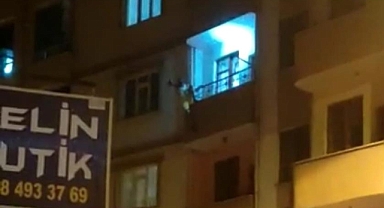 İçip içip kendini balkondan sarkıttı!