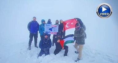 Kar ve tipiye aldırmadan tırmandılar!