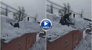Çatıda biriken karlara eğlenceli çözüm