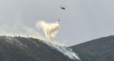 Ormanlık alanda çıkan yangına havadan ve karadan müdahale