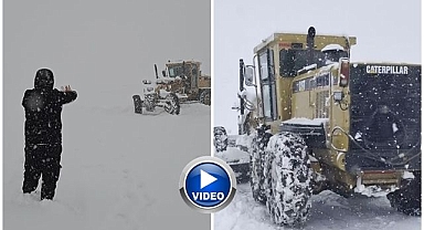 Karla kapanan yolda gazetecilerden iş makinesine destek