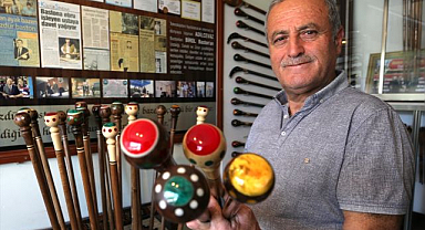 Ödüllü usta, ceviz ağacından yaptığı bastonları kehribarla süsledi