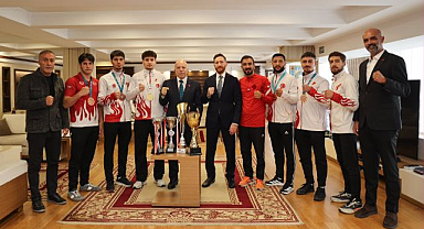 Sekmen'den şampiyon sporculara övgü